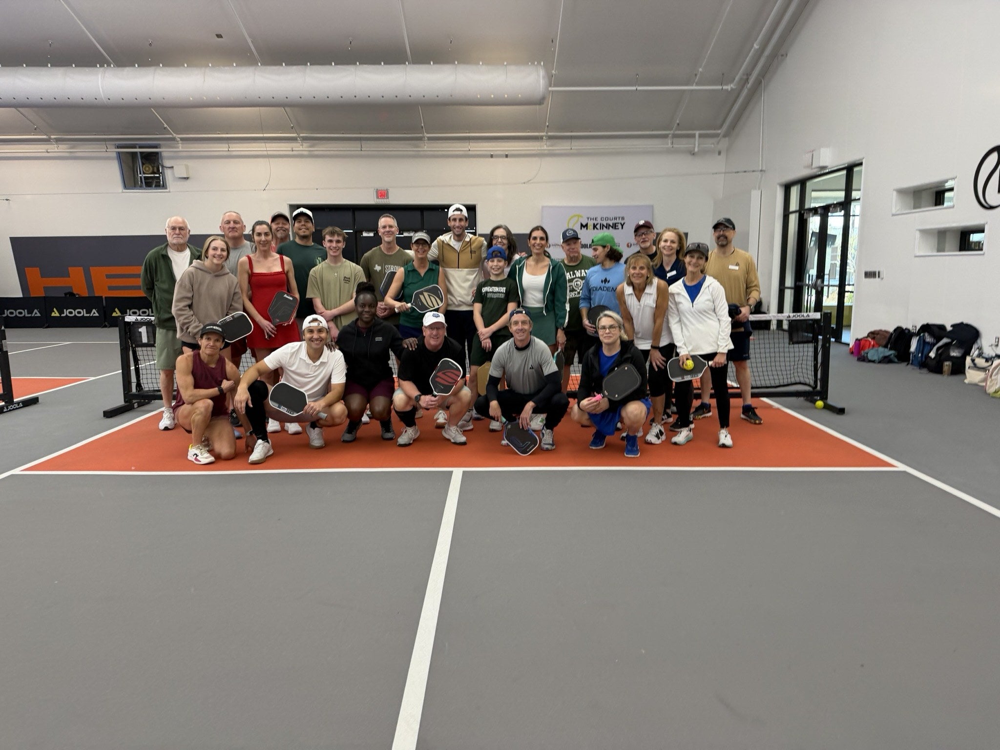 Pickleball players celebrating together with tournament medals
