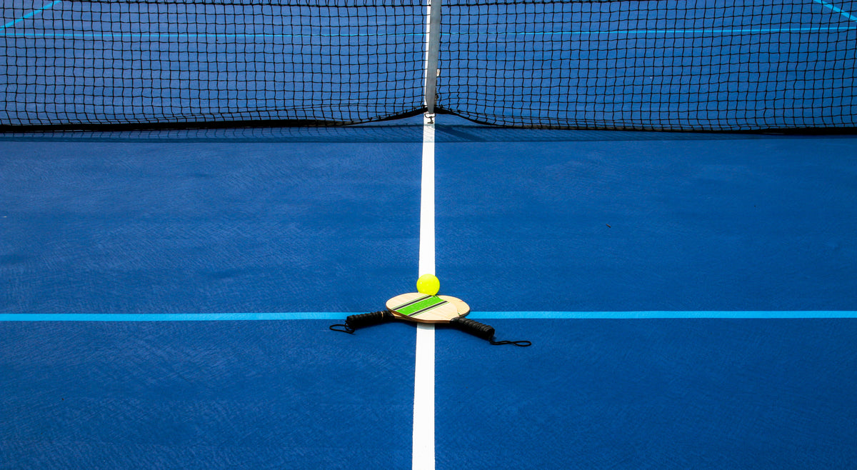 Beginner pickleball players learning the essentials on court