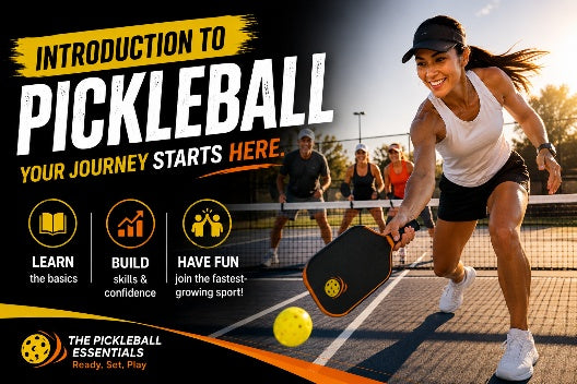 Beginner pickleball players learning together on an outdoor court